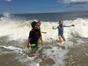 Kids elated in the surf
